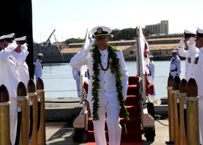 US Navy 100107-N-3560G-002 Cmdr. Edward Herrington is piped ashore after being relieved by Cmdr. Stephen Mack during a change of command ceremony at Naval Station Pearl Harbor