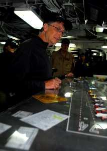 US Navy 100108-N-2475A-037 Bill Gates, Microsoft Corporation chairman and founder, looks at the Ouija board in flight deck control aboard the Nimitz-class aircraft carrier USS John C. Stennis (CVN 74)