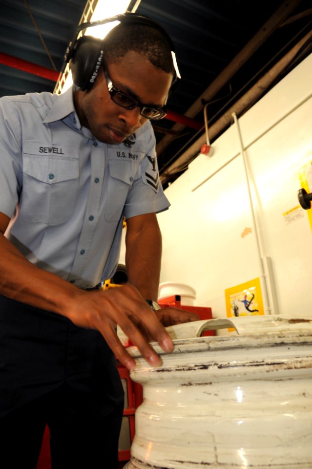 US Navy 100107-N-4031K-012 Aviation Support Equipment Technician 2nd Class Lamont Sewell, assigned to Aircraft Intermediate Maintenance Detachment, inspects