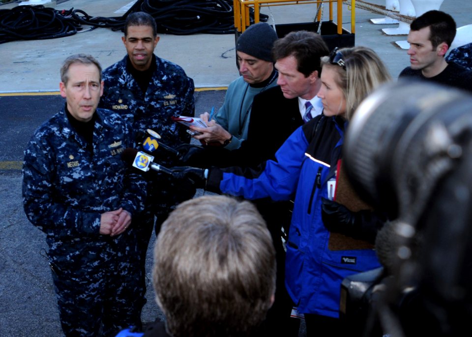 US Navy 100114-N-6764G-005 Capt. Tom Negus responds to questions by local media before USS Bataan (LHD 5) departs Naval Station Norfolk to provide humanitarian assistance to Haiti. ore