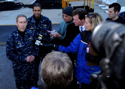 US Navy 100114-N-6764G-005 Capt. Tom Negus responds to questions by local media before USS Bataan (LHD 5) departs Naval Station Norfolk to provide humanitarian assistance to Haiti. ore