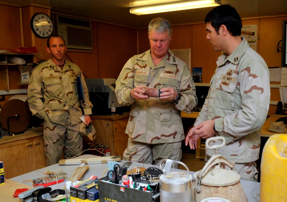 US Navy 100109-N-8273J-238 Chief of Naval Operations (CNO) Adm. Gary Roughead is shown examples of improvised explosive device initiators