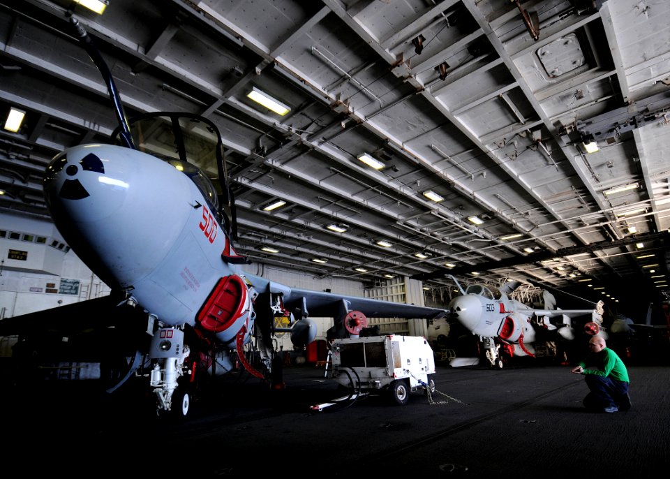US Navy 100108-N-4236E-117 Aviation Structural Mechanic 2nd Class Jeff Jarvis directs Sailors working on an EA-6B Prowler