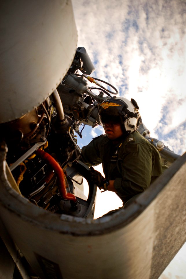 US Navy 100114-N-8590G-007 Lt. John Johnson performs preflight checks at Naval Station Mayport before departing to embark aboard the guided-missile cruiser USS Normandy (CG 60)