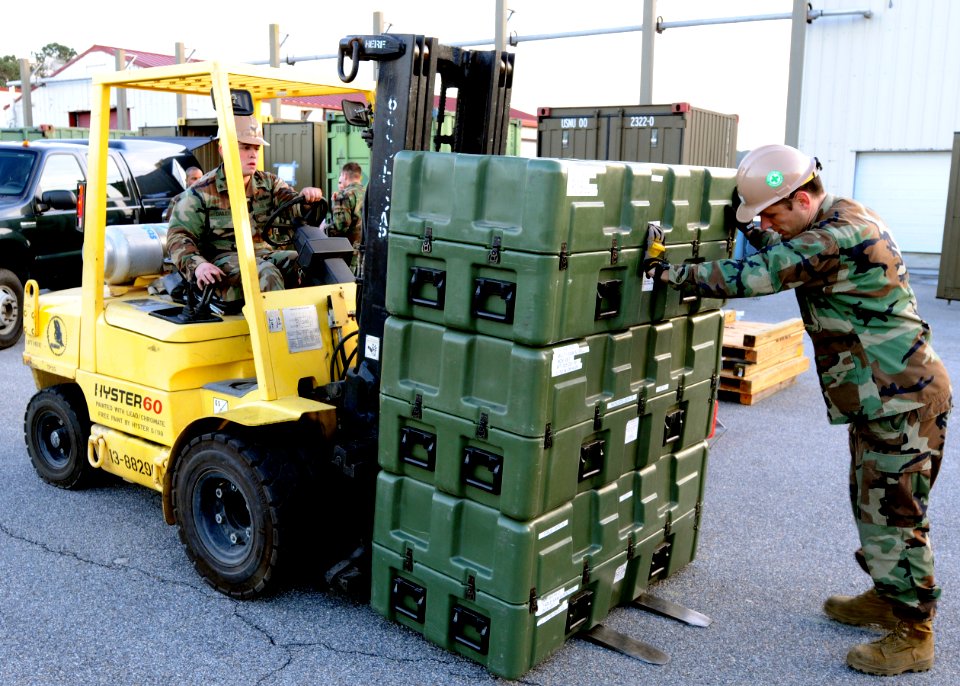 US Navy 100114-N-9095H-003 Sailors load equipment as the unit deploys to conduct humanitarian assistance to earthquake victims in Haiti