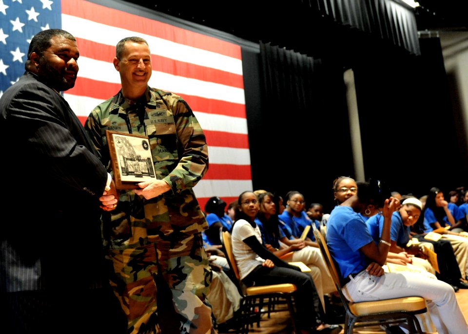 US Navy 100112-N-6889J-089 Capt. Ed Brown presents local attorney Warren L. Conway with an honorary NCBC plaque