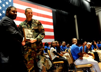 US Navy 100112-N-6889J-089 Capt. Ed Brown presents local attorney Warren L. Conway with an honorary NCBC plaque