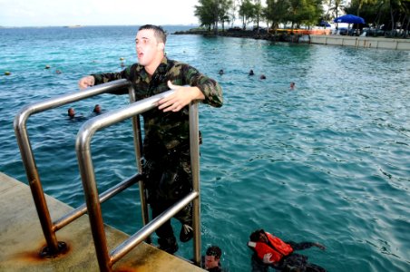 US Navy 100115-N-1906L-004 Master-at-Arms 3rd Class Brandon Marshall, assigned to Maritime Expeditionary Security Squadron (MSRON) 7