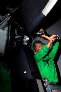 US Navy 100113-N-3327M-083 Aviation Structural Mechanic 3rd Class Eddie Mijares, assigned to the Wallbangers of Carrier Airborne Early Warning Squadron (VAW)