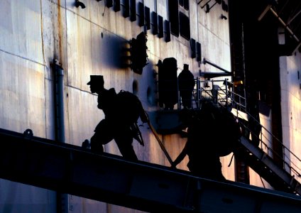US Navy 100115-N-5345W-111 Marines assigned to the 22nd Marine Expeditionary Unit (22nd MEU) embark aboard the multi-purpose amphibious assault ship USS Bataan (LHD 5) during preparations by the Bataan Amphibious Relief Mission