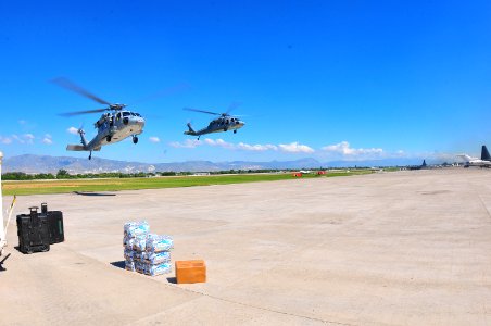 US Navy 100115-N-4774B-874 U.S. Navy SH-60 Sea Hawk helicopters from the aircraft carrier USS Carl Vinson (CVN 70) arrive at the airport in Port-au-Prince, Haiti