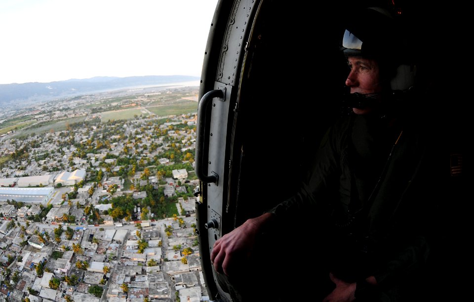 US Navy 100115-N-6247V-055 Rear Adm. Ted N. Branch, commander, Carrier Strike Group (CSG) 1, analyzes the Haitian terrain from a Sea Hawk helicopter