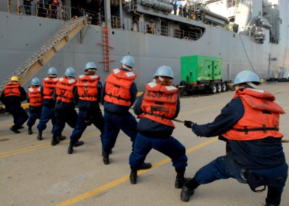 US Navy 100115-N-2456S-050 Sailors secure the brow of the Whidbey Island-class dock landing ship USS Gunston Hall (LSD 44) as the ship departs Joint Expeditionary Base Little Creek-Fort Story
