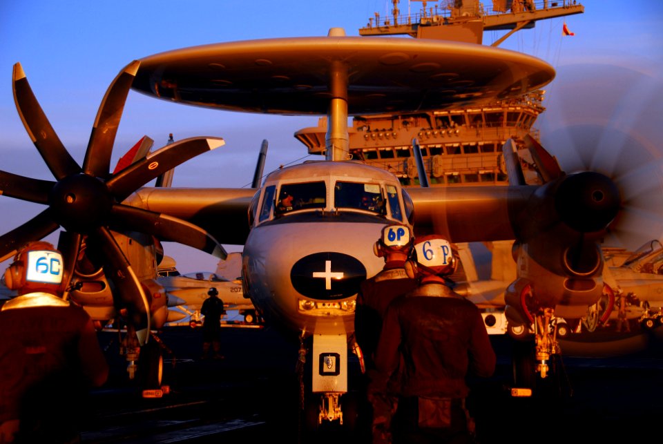 US Navy 100114-N-3327M-132 Sailors assigned to the Wallbangers of Carrier Airborne Early Warning Squadron (VAW) 117 prepare an E-2C Hawkeye for launch