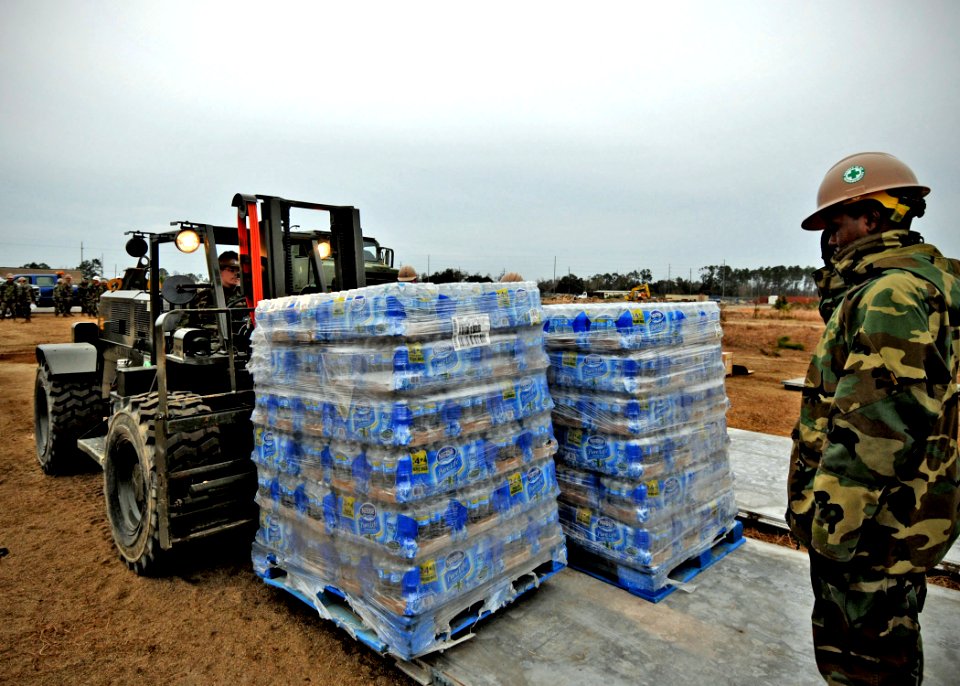 US Navy 100115-N-6889J-010 eabees assigned to Naval Mobile Construction Battalion (NMCB) 7 consolidate pallets at Naval Construction Battalion Center Gulfport