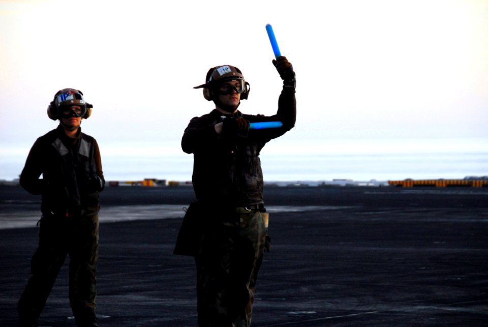 US Navy 100114-N-3327M-161 Aviation Electrician's Mate Airman Michael McGehee and Aviation Ordnanceman Airman Caitlin Cullen, both assigned to the Black Aces of Strike Fighter Squadron (VFA) 41