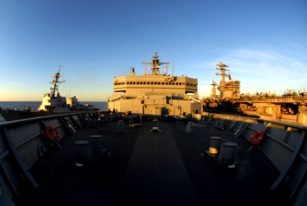 US Navy 100114-N-2600H-187 USNS Bridge (T-AOE 10) performs a replenishment at sea with USS Sampsom (DDG 102) and USS Nimitz (CVN 68)