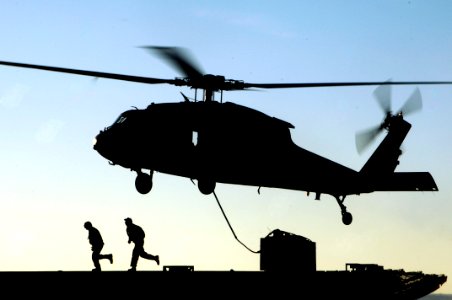 US Navy 100114-N-3038W-627 Crew members aboard the Military Sealift Command fast combat support ship USNS Bridge (T-AOE 10)