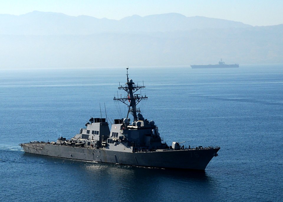 US Navy 100115-N-6247V-596 The guided-missile destroyer USS Higgins (DDG 76), foreground, and Nimitz-class aircraft carrier USS Carl Vinson (CVN 70) arrive off the coast of Haiti