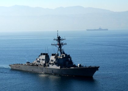 US Navy 100115-N-6247V-596 The guided-missile destroyer USS Higgins (DDG 76), foreground, and Nimitz-class aircraft carrier USS Carl Vinson (CVN 70) arrive off the coast of Haiti