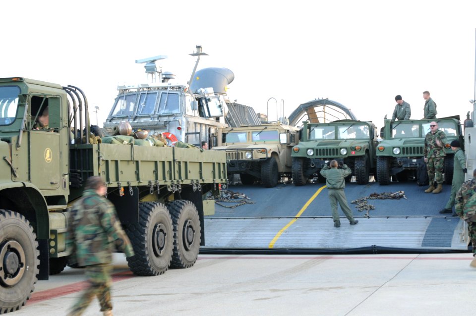US Navy 100114-N-5787K-003 Seabees assigned to Amphibious Construction Battalion (ACB) 2 load vehicles and equipment onto landing craft air cushion vehicles to support Operation Unified Response