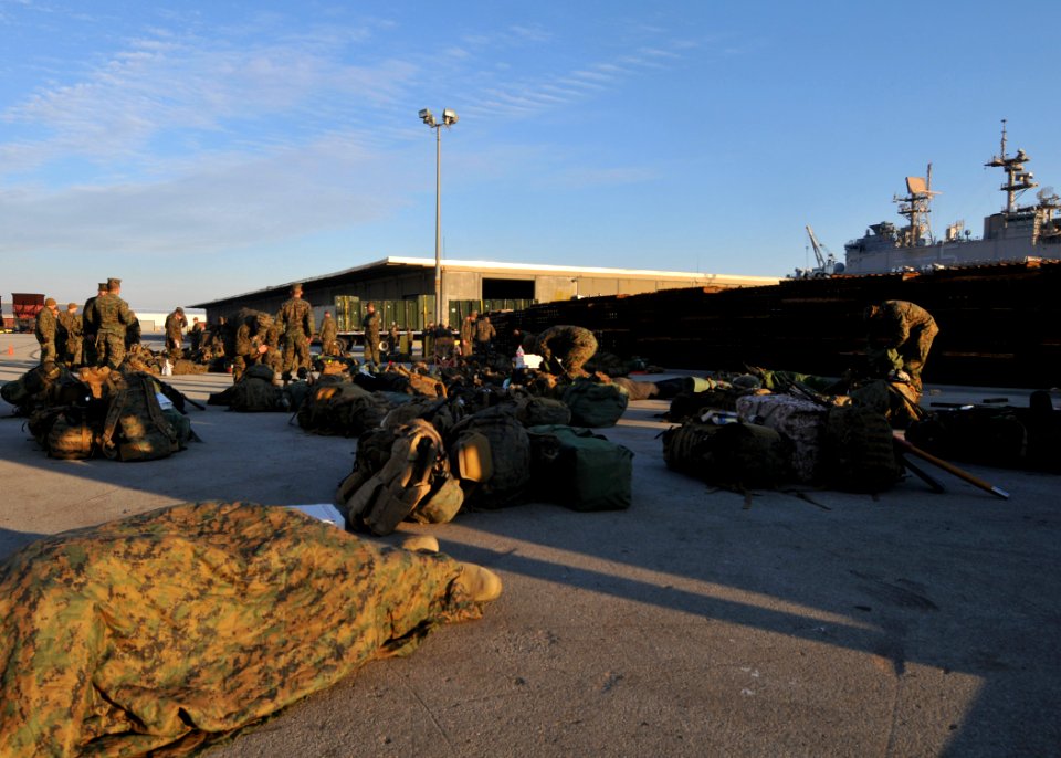US Navy 100115-N-1831S-054 Marines organize their gear to take aboard USS Bataan (LHD 5)