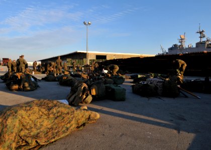 US Navy 100115-N-1831S-054 Marines organize their gear to take aboard USS Bataan (LHD 5)
