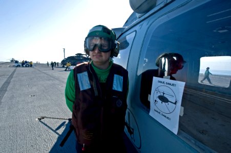 US Navy 100115-N-2953W-314 A sign is posted on the side of an SH-60F Sea Hawk assigned to the Tridents of Helicopter Anti-Submarine Squadron (HS) 3 to warn locals of helicopter safety concerns