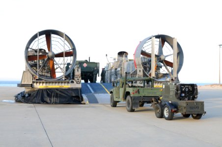 US Navy 100114-N-5787K-004 Seabees assigned to Amphibious Construction Battalion (ACB) 2 load vehicles and equipment onto landing craft air cushion vehicles to support Operation Unified Response