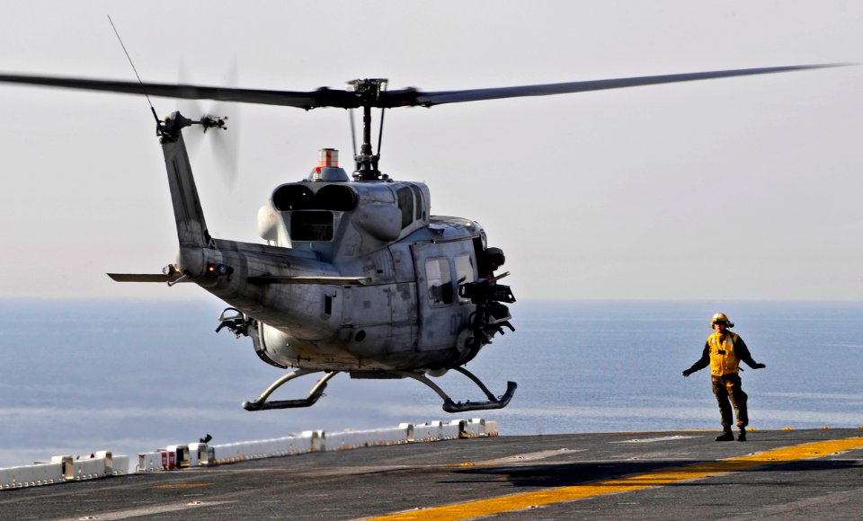 US Navy 100116-N-5345W-058 UH-1N Huey from the Sabers of Marine Light Attack Helicopter Squadron (HMLA) 467 prepares to touch down on the multi-purpose amphibious assault ship USS Bataan (LHD 5)
