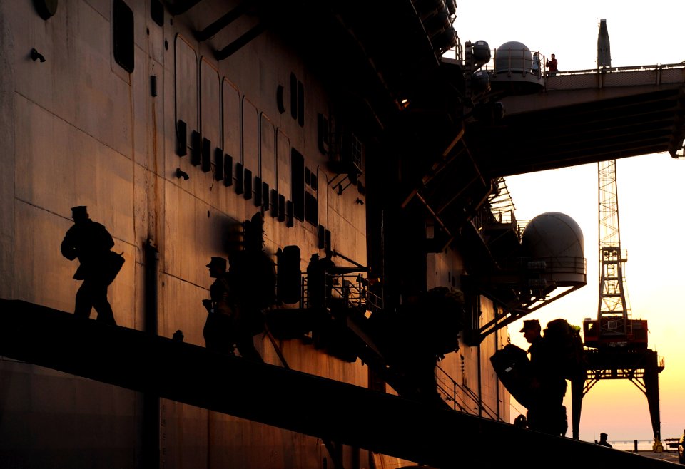 US Navy 100115-N-5345W-138 Marines assigned to the 22nd Marine Expeditionary Unit (22nd MEU) embark aboard the multi-purpose amphibious assault ship USS Bataan (LHD 5) during preparations by the Bataan Amphibious Relief Mission