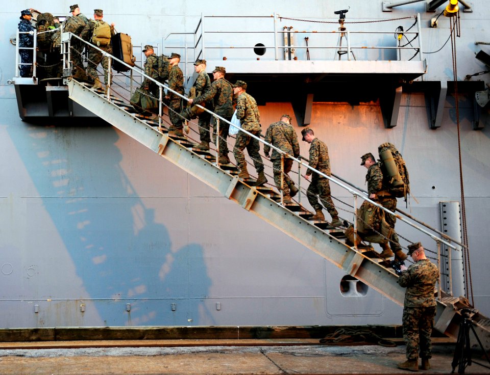 US Navy 100115-N-5345W-090 Marines assigned to the 22nd Marine Expeditionary Unit (22nd MEU) embark aboard the multi-purpose amphibious assault ship USS Bataan (LHD 5) during preparations by the Bataan Amphibious Relief Mission