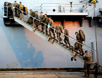 US Navy 100115-N-5345W-090 Marines assigned to the 22nd Marine Expeditionary Unit (22nd MEU) embark aboard the multi-purpose amphibious assault ship USS Bataan (LHD 5) during preparations by the Bataan Amphibious Relief Mission