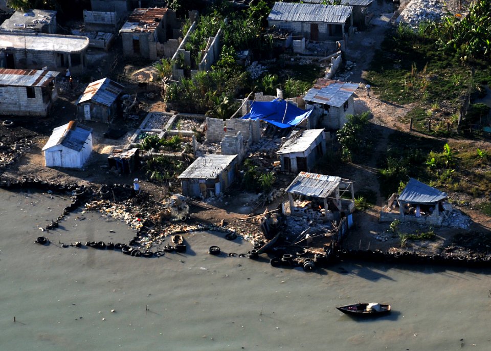 US Navy 100115-N-6247V-195 Homes lie in shambles after sustaining significant damage in a 7.0 earthquake disaster on Jan. 12