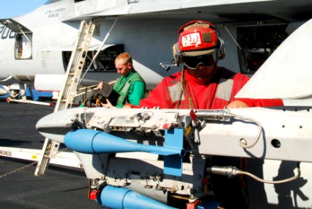 US Navy 100117-N-3327M-029 Aviation Ordnanceman 1st Class Miguel Trejo and Aviation Electronics Technician Airman Gregory Schroeder
