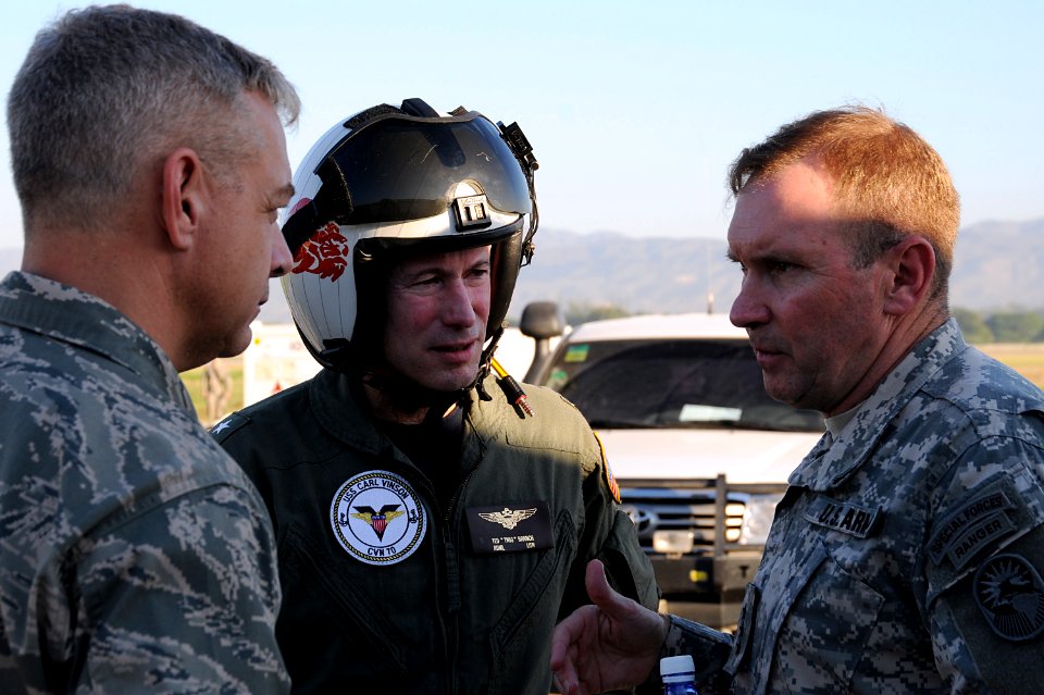 US Navy 100115-N-6247V-118 Rear Adm. Ted N. Branch, center, commander, Carrier Strike Group (CSG) 1, speaks with Army Lt. Gen. Keen, right and Air Force Col. Ament, left upon his arrival in Haiti Jan. 15