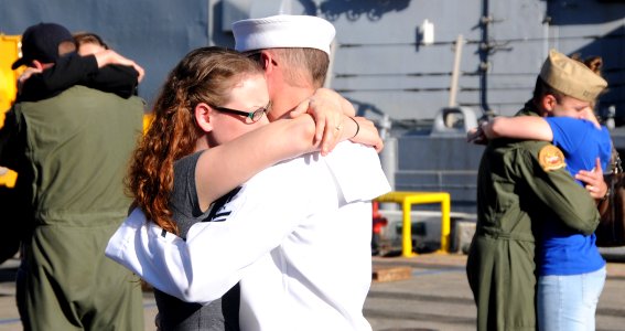 US Navy 100115-N-3666S-007 Sailors say good-bye to their loved ones as they prepare to board the guided-missile frigate USS Reuben James (FFG 57)