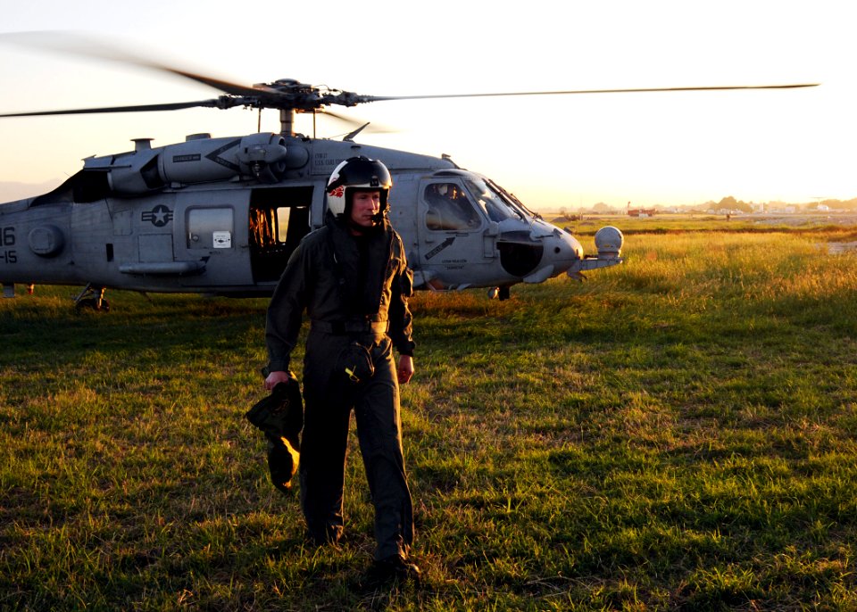 US Navy 100115-N-6247V-083 Rear Adm. Ted N. Branch, Commander, Carrier Strike Group 1 (CSG-1), exits an Sea Hawk helicopter assigned to Helicopter Anti-Submarine Squadron (HS) 15 upon his arrival in Haiti Jan. 15
