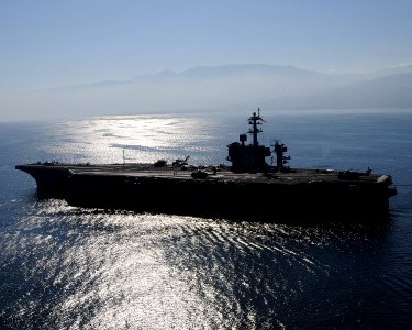US Navy 100115-N-6247V-562 The Nimitz-class aircraft carrier USS Carl Vinson (CVN 70) awaits the return of aircraft off the coast of Haiti
