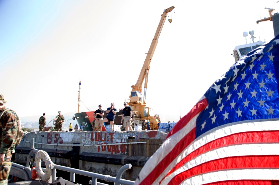 US Navy 100118-N-1134L-261 Members of a U.S. Navy and Army joint-service dive task force conduct an assessment of port facilities during an inspection of the port in Port-au-Prince, Haiti