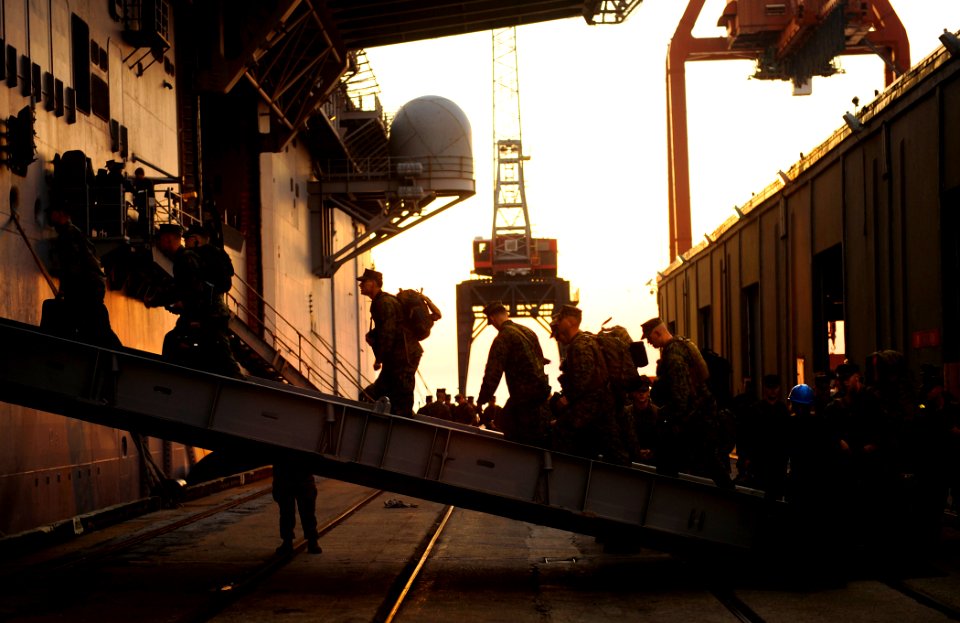 US Navy 100115-N-5345W-095 Marines assigned to the 22nd Marine Expeditionary Unit (22nd MEU) embark aboard the multi-purpose amphibious assault ship USS Bataan (LHD 5) during preparations by the Bataan Amphibious Relief Mission
