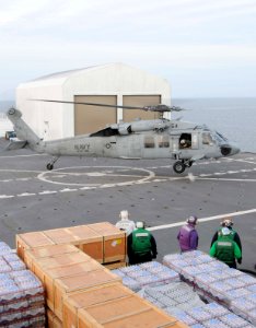 US Navy 100116-N-6410J-146 Sailors aboard USNS Comfort (T-AH 20) prepare to refuel a MH-60S Knighthawk helicopter