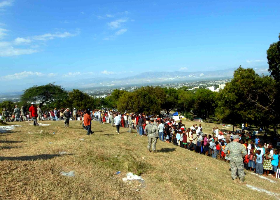 US Navy 100117-N-6639M-090 U.S. military members distribute food and water to Haitian citizens that were affected by the 7.0 magnitude earthquake on Jan. 12, 2010