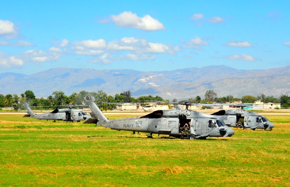 US Navy 100116-N-4774B-712 Three SH-60F Seahawk helicopters attached to Helicopter Anti-Submarine Squadron (HS) 11 prepare to take off after picking up water and supplies