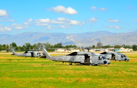 US Navy 100116-N-4774B-712 Three SH-60F Seahawk helicopters attached to Helicopter Anti-Submarine Squadron (HS) 11 prepare to take off after picking up water and supplies