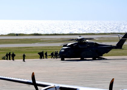 US Navy 100115-N-8241M-153 Sailors board an MH-53E Sea Dragon at the airfield at Naval Station Guantanamo Bay