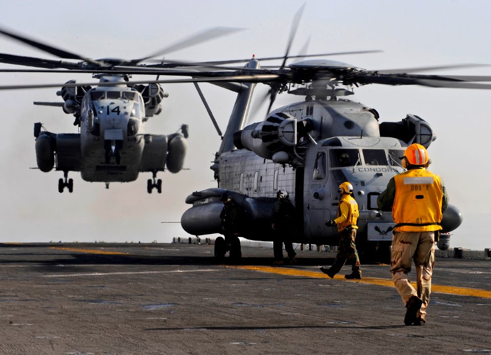 US Navy 100116-N-5345W-039 A pair of CH-53E Super Stallions from the Ironhorse of Marine Heavy Helicopter Squadron (HMH) 461 prepares to touch down on the multi-purpose amphibious assault ship USS Bataan (LHD 5)