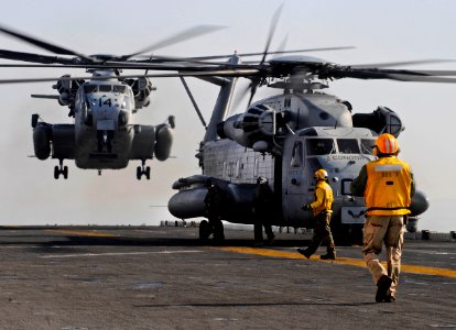 US Navy 100116-N-5345W-039 A pair of CH-53E Super Stallions from the Ironhorse of Marine Heavy Helicopter Squadron (HMH) 461 prepares to touch down on the multi-purpose amphibious assault ship USS Bataan (LHD 5)