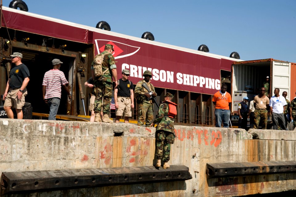 US Navy 100118-N-1134L-241 Members of a U.S. Navy and Army joint-service dive task force conduct an assessment of port facilities during an inspection of the port in Port-au-Prince, Haiti