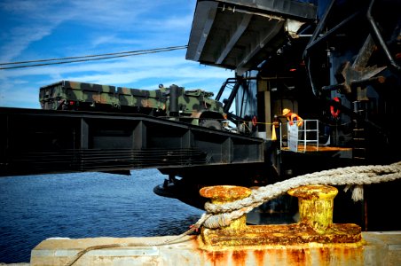 US Navy 100118-N-1522S-008 The Military Sealift Command maritime prepositioning ship USNS 1st LT Jack Lummus (T-AK-3011) receives cargo from the U.S. Agency for International Development (USAID) and the U.S. Marine Corps at Blo photo